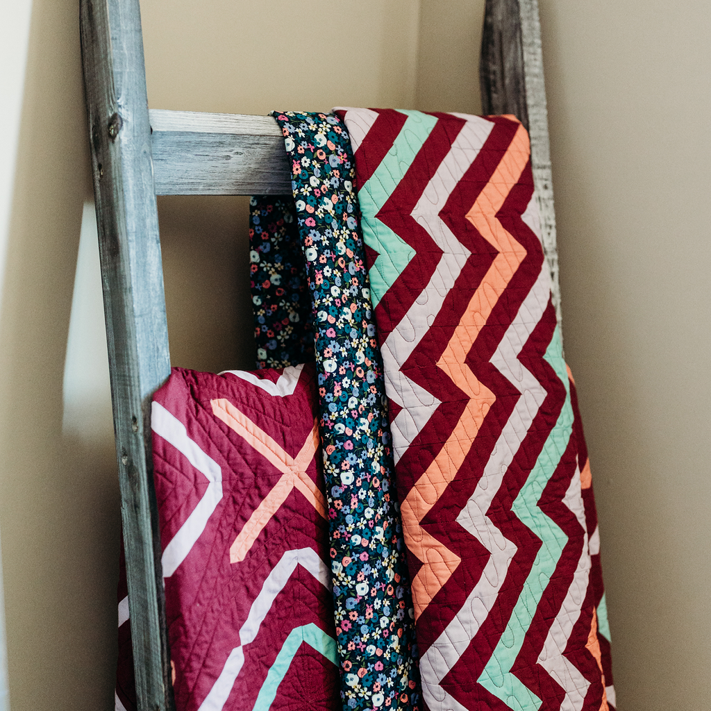 Manderley Makes quilt ladder with plum Park Avenue and Southampton quilts