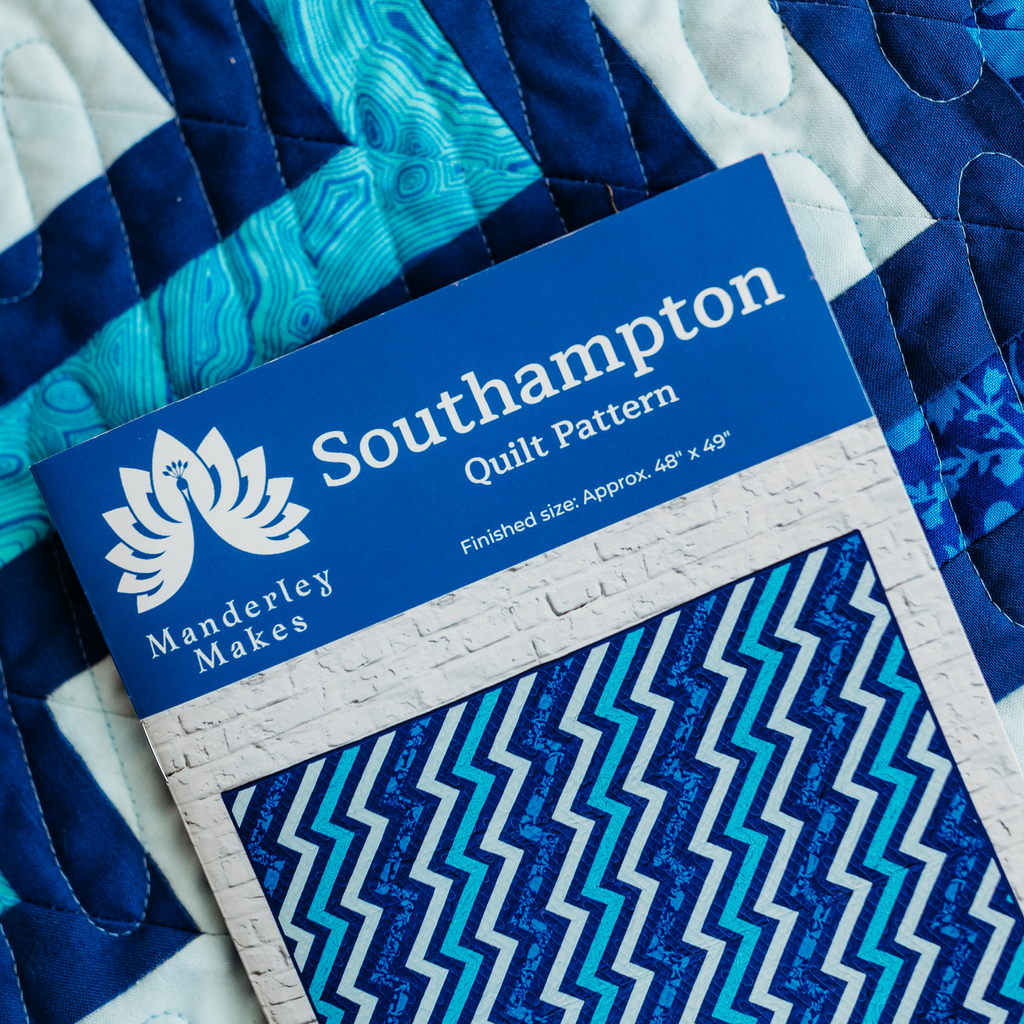 Southampton quilt pattern booklet on top of blue Southampton quilt
